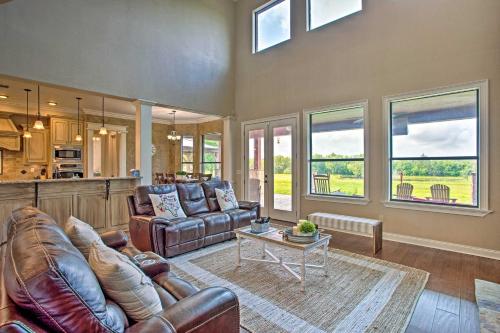 a living room with a couch and a table at Blue Ridge Home with Game Room 14 Mi to McKinney! in Blue Ridge