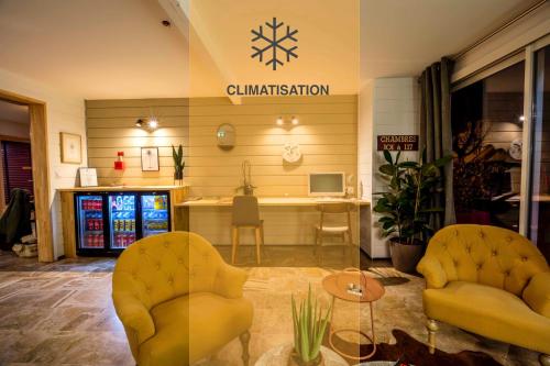 a store with two chairs and a counter in a room at Ostal Pau Universite - Sure Hotel Collection by Best Western in Pau