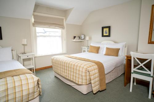Postel nebo postele na pokoji v ubytování Cullinan's Guesthouse