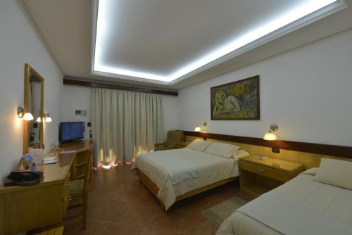 Ein Bett oder Betten in einem Zimmer der Unterkunft Hotel Restaurant Papillon
