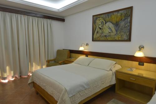 Ein Bett oder Betten in einem Zimmer der Unterkunft Hotel Restaurant Papillon