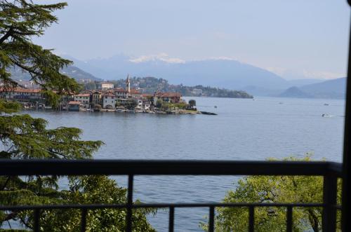 a view of a large body of water with buildings at Hotel Villa Ruscello in Baveno