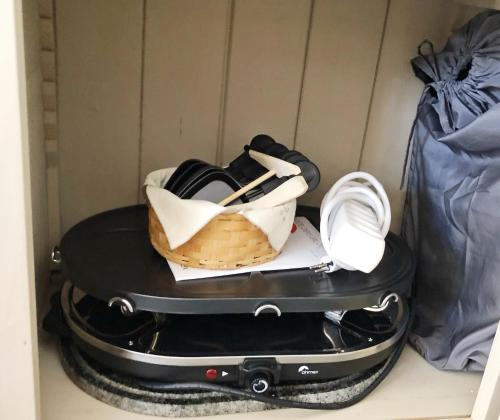 a suitcase with a basket and a bag on top at Magnifique Maison près du centre in Nendaz