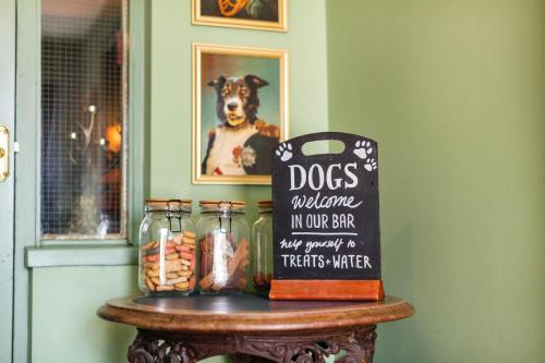 a table with a dog in our shop sign on it at The Fromeway in Radstock