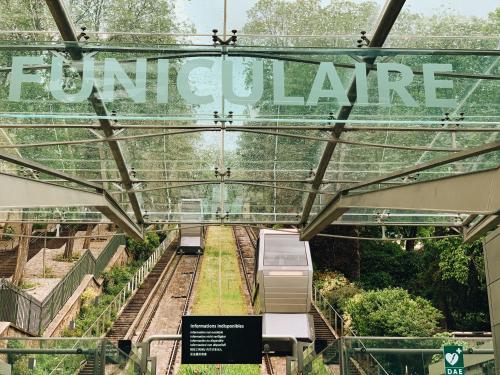 a view of a garden with a sign that reads future at Hotel Bellevue Montmartre in Paris