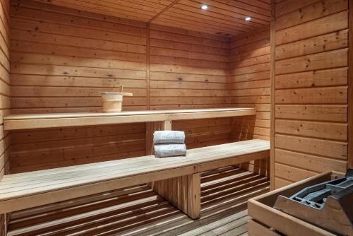 a sauna with a bench and a cup of coffee at AP Maria Nova Lounge - Adults Friendly in Tavira