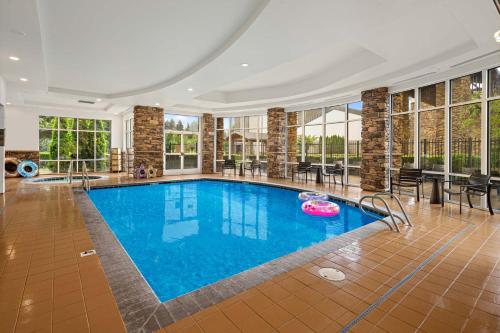 a swimming pool in a large room with windows at Lucky Eagle Casino & Hotel (Washington) in Rochester