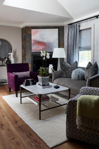 a living room with a couch and a coffee table at The Cornell Inn, Lenox & The Berkshires in Lenox