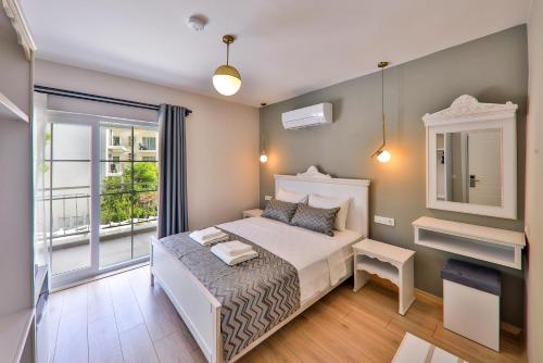 Säng eller sängar i ett rum på Lora Kaş Hotel