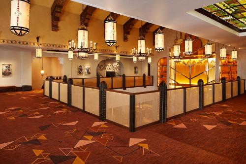 a lobby with a large room with stars on the floor at The Plaza Hotel Pioneer Park in El Paso