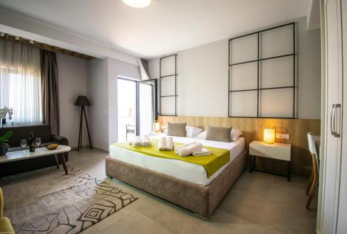 a bedroom with a bed and a desk in a room at Hotel Hills Ulcinj in Ulcinj
