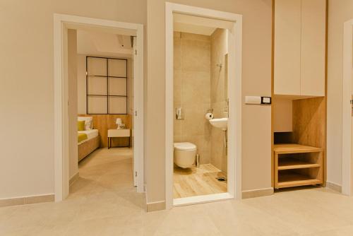 a bathroom with a toilet and a sink at Hotel Hills Ulcinj in Ulcinj