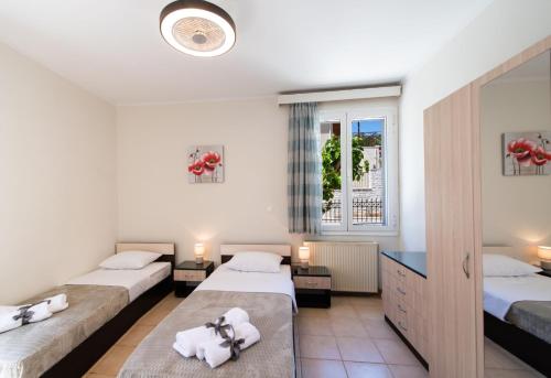 A bed or beds in a room at Irinis House