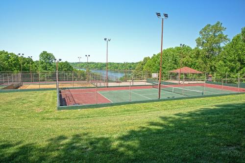 a tennis court with two tennis nets on a field at Barren River Lake State Resort Park in Lucas