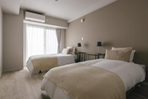 Кровать или кровати в номере THREE - Vacation STAY 38688v