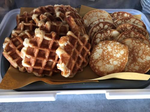 a tray of waffles and pastries on a table at Hotel Svizzera in Arma di Taggia