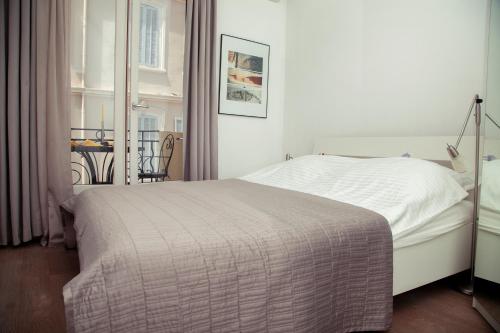 Кровать или кровати в номере AnaZa Appartement