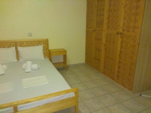 Ένα ή περισσότερα κρεβάτια σε δωμάτιο στο Simos Apartments