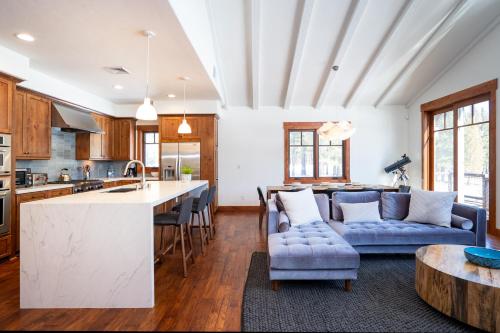 a kitchen and living room with a couch and a table at New Listing! Luxury 3BD Residence on Gray's Crossing Golf Course in Truckee