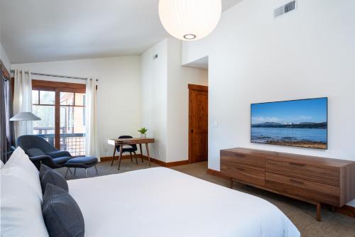 a bedroom with a bed and a tv on a wall at New Listing! Luxury 3BD Residence on Gray's Crossing Golf Course in Truckee