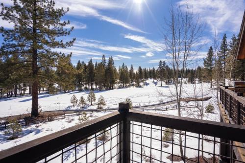 a winter view from the balcony of a house at New Listing! Luxury 3BD Residence on Gray's Crossing Golf Course in Truckee