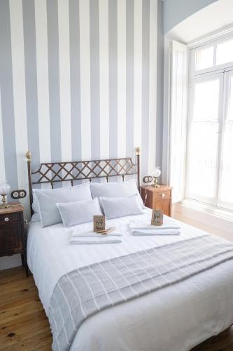 a bedroom with a large bed with two plates on it at La Venta de Miyares - Casa de Indianos in Piloña