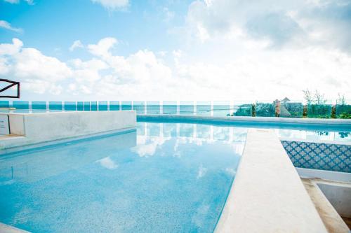 a swimming pool on top of a building at Spirit Holbox in Holbox Island