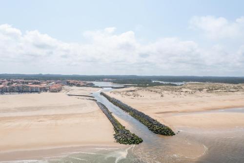an aerial view of a beach with a river at Résidence Lou Cout in Vieux-Boucau-les-Bains