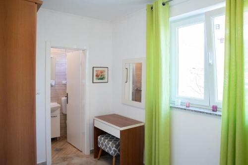 Postel nebo postele na pokoji v ubytování Apartmani Vrtodusic