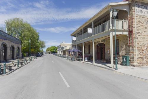 an empty street in a town with a building at Dunstan House in Clyde