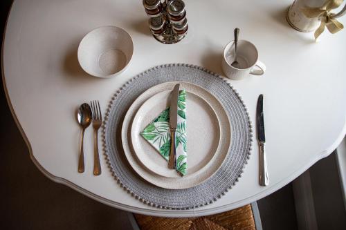 a plate with a piece of cake on a table at Apple Tree Bed and Breakfast in Tavistock