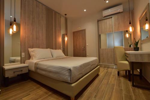 מיטה או מיטות בחדר ב-Gonis Grand Luxury Suite