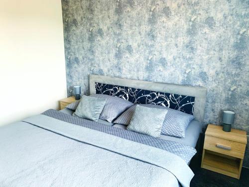 Postel nebo postele na pokoji v ubytování Apartmány na Zahradní