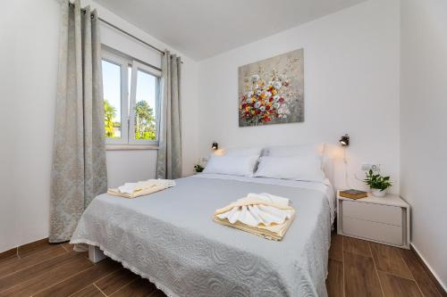 Postel nebo postele na pokoji v ubytování Apartment Nada 1