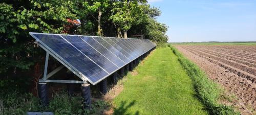 a solar panel in the middle of a field at Gadegaard Apartment in Ringkøbing