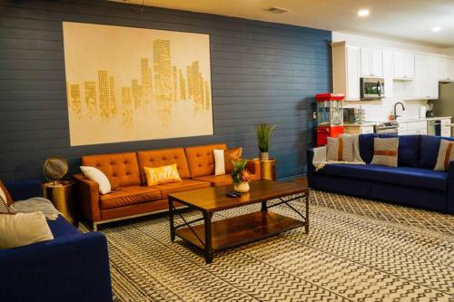 a living room with a couch and a coffee table at Dallas 4BR Large yard w HOT TUB , Fire pit and basketball Hoop in Dallas