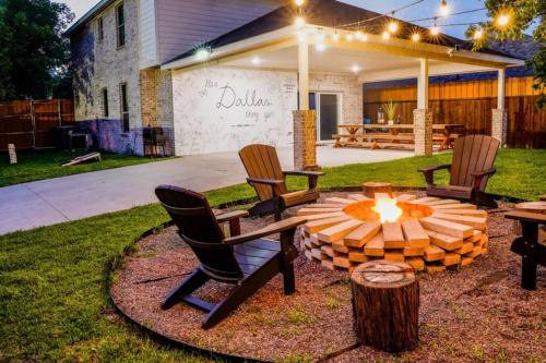 a group of chairs sitting around a fire pit in a yard at Dallas 4BR Large yard w HOT TUB , Fire pit and basketball Hoop in Dallas