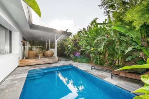 a swimming pool in the backyard of a house at Foam in Byron Bay