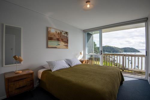 Postel nebo postele na pokoji v ubytování Mangonui Motel