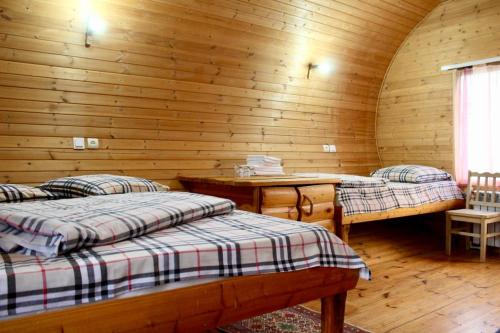 a room with two beds in a wooden cabin at Harsnadzor Eco Resort in Halidzor