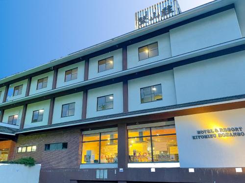a large building with windows on the side of it at Hotel & Resort Kiyomizu Bozanso in Yamanouchi