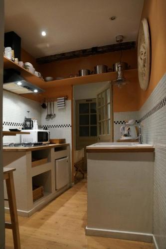 a kitchen with a sink and a counter top at Studio Rempart in Brussels