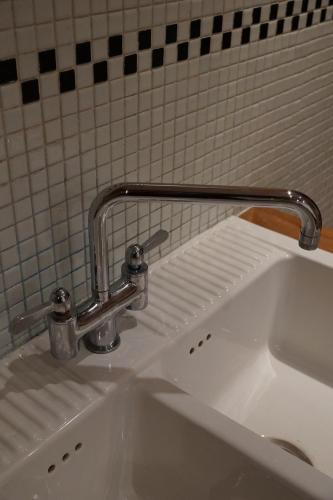 a sink with a faucet on top of it at Studio Rempart in Brussels