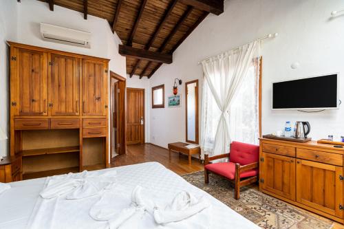 Ένα ή περισσότερα κρεβάτια σε δωμάτιο στο Ephesus Lodge