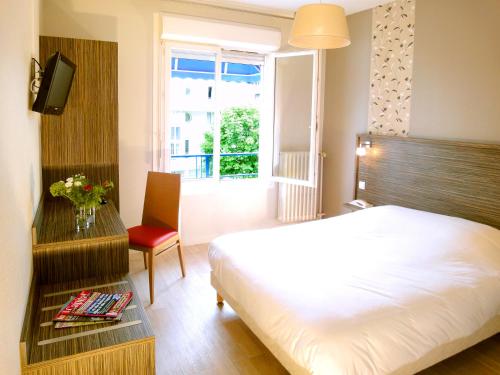 Postel nebo postele na pokoji v ubytování Hotel les Pecheurs
