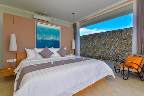 Ένα ή περισσότερα κρεβάτια σε δωμάτιο στο Deep Blue Villa Umeanyar