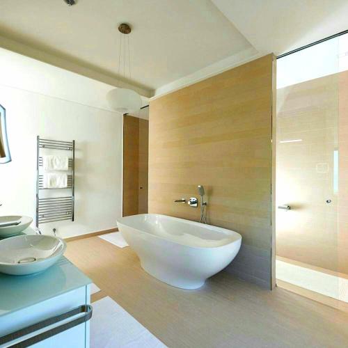 a bathroom with a large white tub and a shower at PRIVE The Luxury Villa & Boutique Hotel, Cape of Rodon in Draç