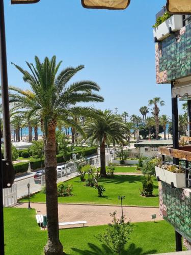 a palm tree in the middle of a park at COSTA DAURADA APARTAMENTS - 174 Formentor Luxe II in Salou