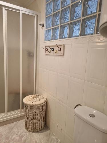 a bathroom with a shower and a toilet and a window at COSTA DAURADA APARTAMENTS - 174 Formentor Luxe II in Salou