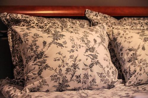 a pair of pillows sitting on top of a bed at Branicki Apartments in Białystok